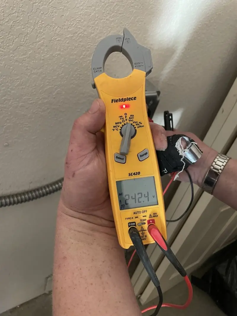 Voltage testing with clamp meter during Generator Installation in North Decatur